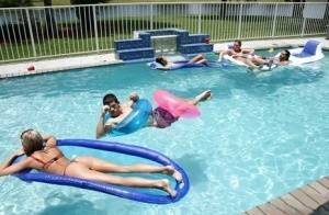 Frolic girls in bikini flashing their tits at the pool party on leakfanatic.com