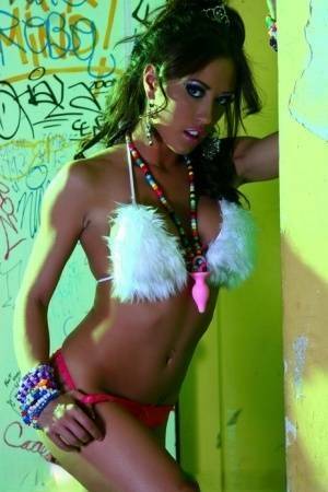 Hot MILF Capri Cavanni peels off her bikini amid graffiti in furry boots on leakfanatic.com