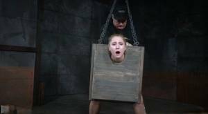 Blonde girl Odette Delacroix is made to suck a black cock with head in stocks on leakfanatic.com