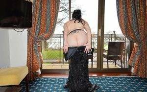 Over 30 amateur Barby Slut slips off a long gown to pose nude in nylons on leakfanatic.com