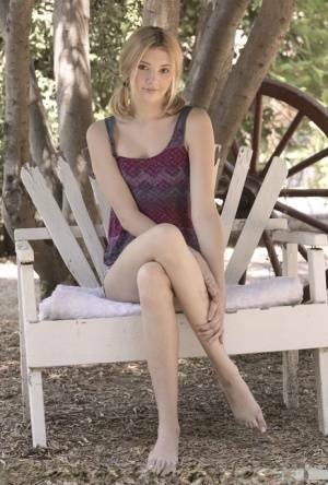 Teen first timer Lena Anderson vaunts her lithe body under a tree outside on leakfanatic.com