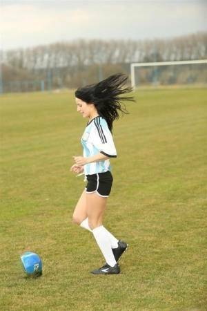 Barely legal soccer player removes her uniform before masturbating on a bench on leakfanatic.com