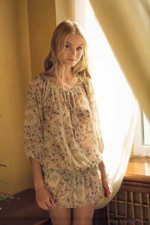 Cute blonde teen Nancy A slips off her floral dress to model naked on leakfanatic.com