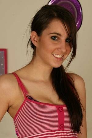 Young brunette Stacy H gets completely naked on a wooden table on leakfanatic.com