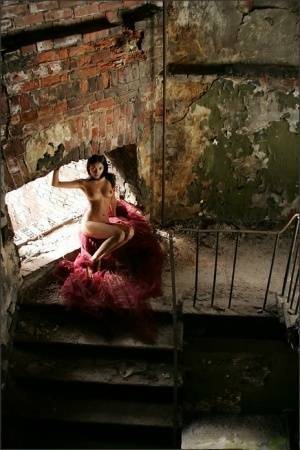 Slim brunette with a great ass models totally naked in deserted building on leakfanatic.com