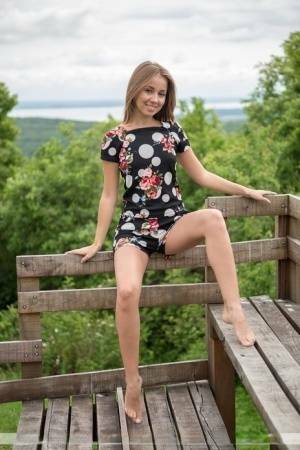 Barefoot teen Linda A gets totally naked at a lookout spot in the woods on leakfanatic.com
