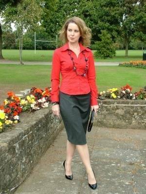 Fully clothed woman steps out of a stiletto heel while visiting a public park on leakfanatic.com