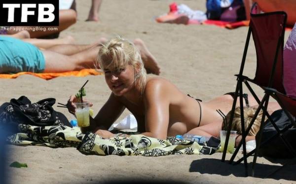 Sarah Connor Flashes Her Nude Breasts on the Beach on leakfanatic.com