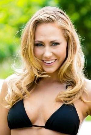 Exceptionally beautiful babe Carter Cruise lies on green grass on leakfanatic.com