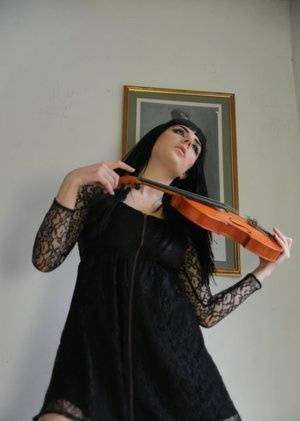 Dark haired violin player Sam Bentley strikes great poses while getting naked on leakfanatic.com