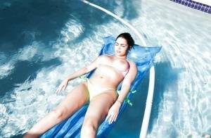 Brunette babe model Ada S going topless on air mattress in swimming pool on leakfanatic.com