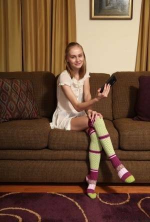 Adorable teen Alicia Williams takes a selfie before getting naked in OTK socks on leakfanatic.com