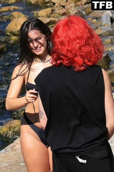 Addison Rae Displays Her Curves in a Black Bikini on Holiday with Omer Fedi on Lake Como on leakfanatic.com