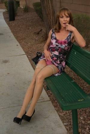 Aged lady flashes her tits and twat on a public bench before disrobing at home on leakfanatic.com