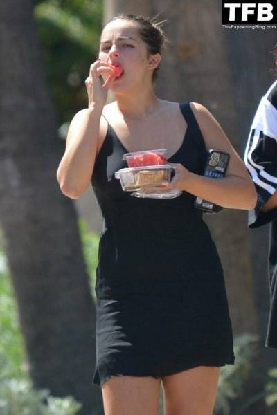 Addison Rae Indulges in Some Refreshing Watermelon While Out in a Tight Skirt with Her Boyfriend on leakfanatic.com